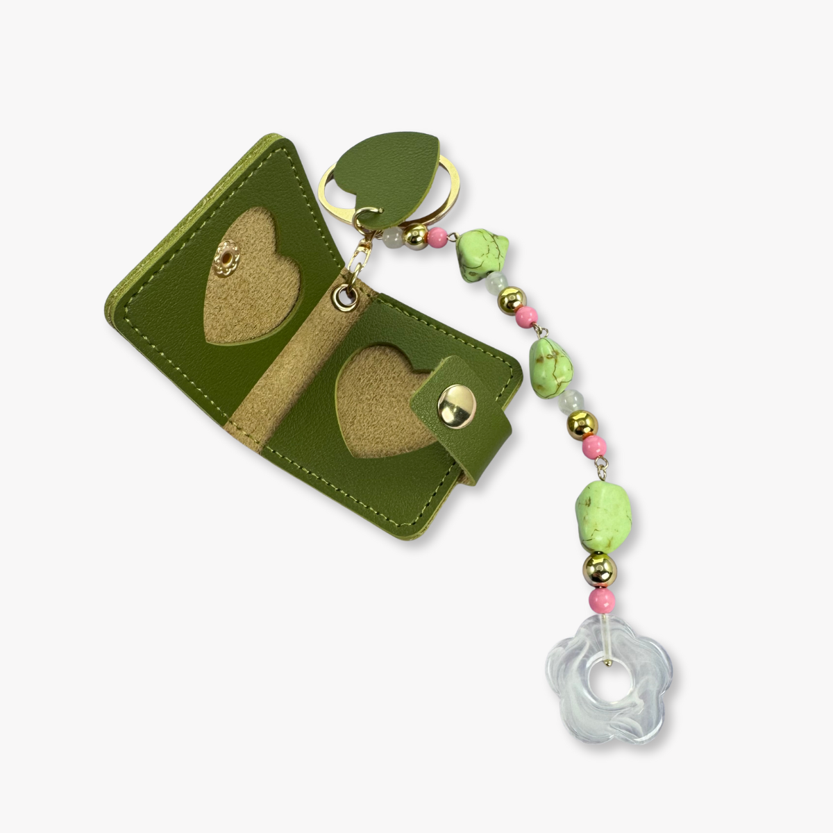 Green keychain with heart designs and colorful beads on a white background