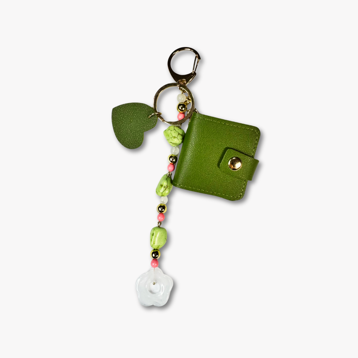 Green keychain with beads and a small pouch on a white background